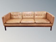 A late 20th century tan leather three seater settee length 203 cm