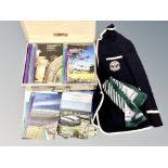 A vintage suitcase and crate containing Wimbledon programmes and related clothing