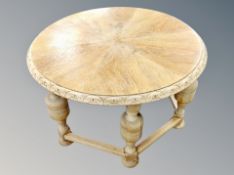 A Danish blond oak circular coffee table,