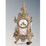 A French gilt metal and porcelain eight day mantel clock