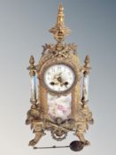 A French gilt metal and porcelain eight day mantel clock