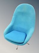A 20th century Scandinavian swivel armchair in turquoise fabric on chrome base