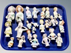 A collection of china half dolls