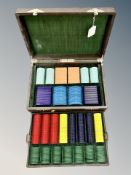 A set of early Twentieth Century gaming counters/croupiers chips, in various colours and shapes,