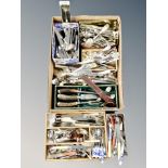 A box and cutlery tray containing assorted flatware,