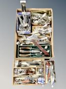 A box and cutlery tray containing assorted flatware,