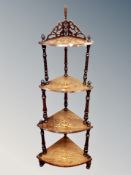 An inlaid rosewood Victorian four tier what not