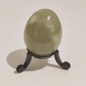 A Nephrite jade egg from Brazil, no stand included, and a Chalcedony stalacite crystal from Peru.