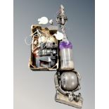 A Dyson DC 25 upright vacuum cleaner and Hoover hand held vacuum,