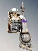 A Dyson DC 25 upright vacuum cleaner and Hoover hand held vacuum,