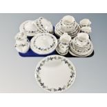 Approximately fifty one pieces of Royal Doulton Burgundy tea and dinner china