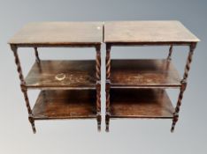 A pair of Edwardian oak barley twist three tier occasional tables