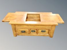 A contemporary oak storage coffee table,