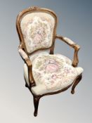 A continental carved beech armchair