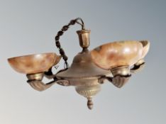 A Continental brass and marbled glass pendant light fitting