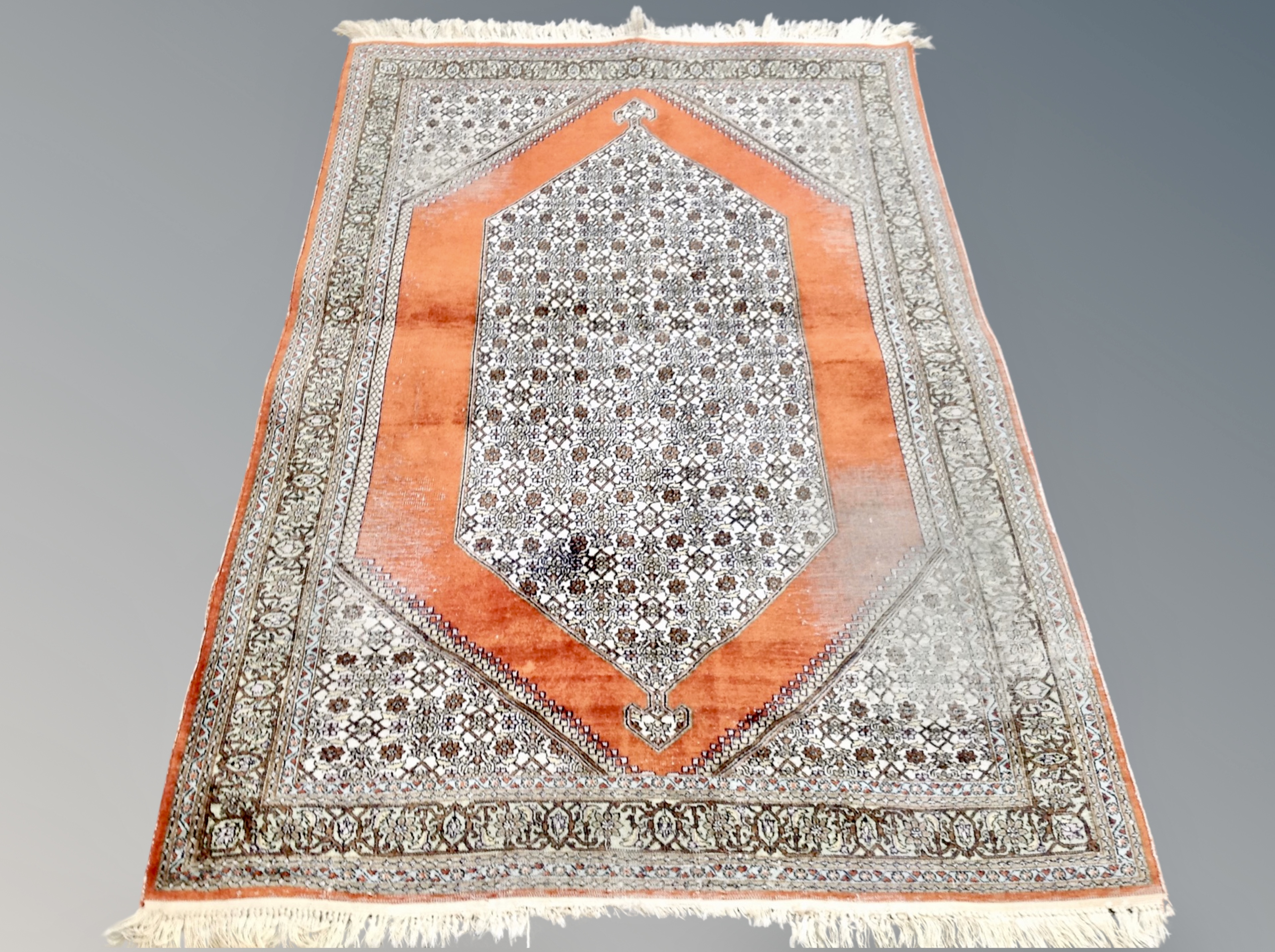 A Tabriz rug, Iranian Azerbaijan, on coral ground,