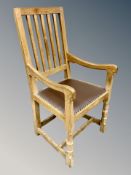 Mouseman : A Robert Thompson English oak chair with studded leather seat and vertical railed back,