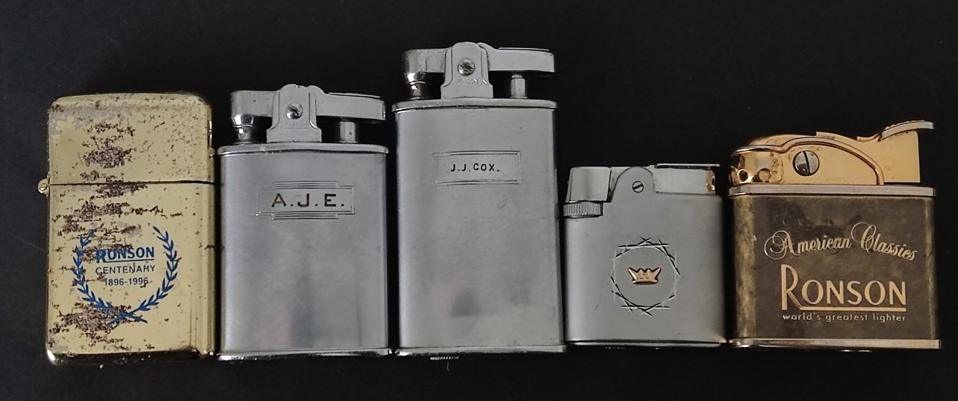 A collection of five Ronson lighters.