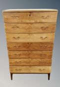 A Danish walnut chest of seven drawers,