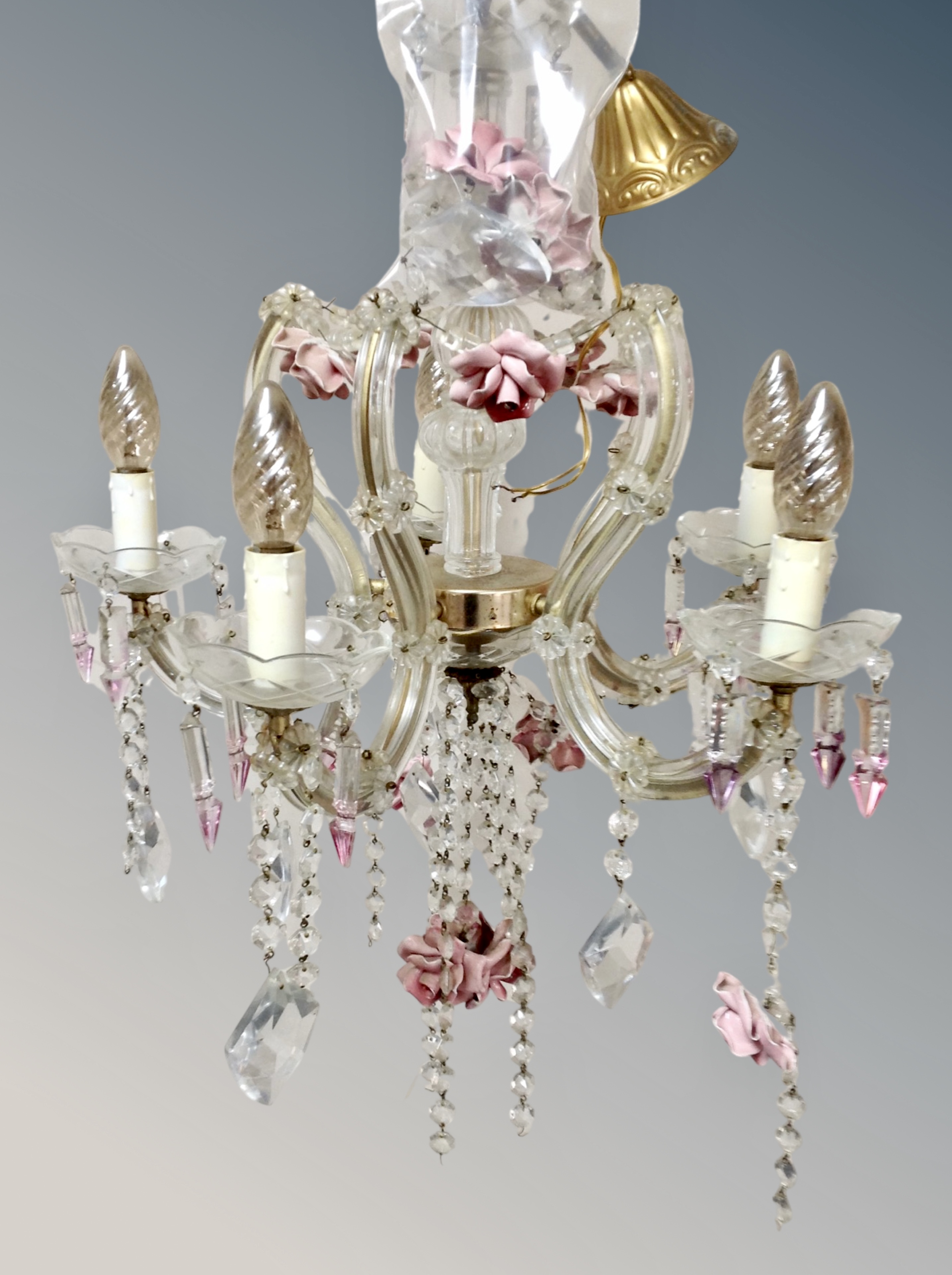 A Venetian crystal and porcelain five branch chandelier, wired for electricity,