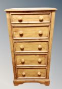 A contemporary five drawer slim chest,