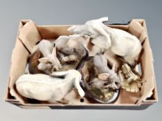 A box of several cast resin elephant figures and further figure of leaping greyhounds