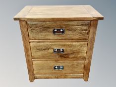 A contemporary stained oak three drawer chest,