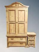 A contemporary carved pine double door wardrobe,