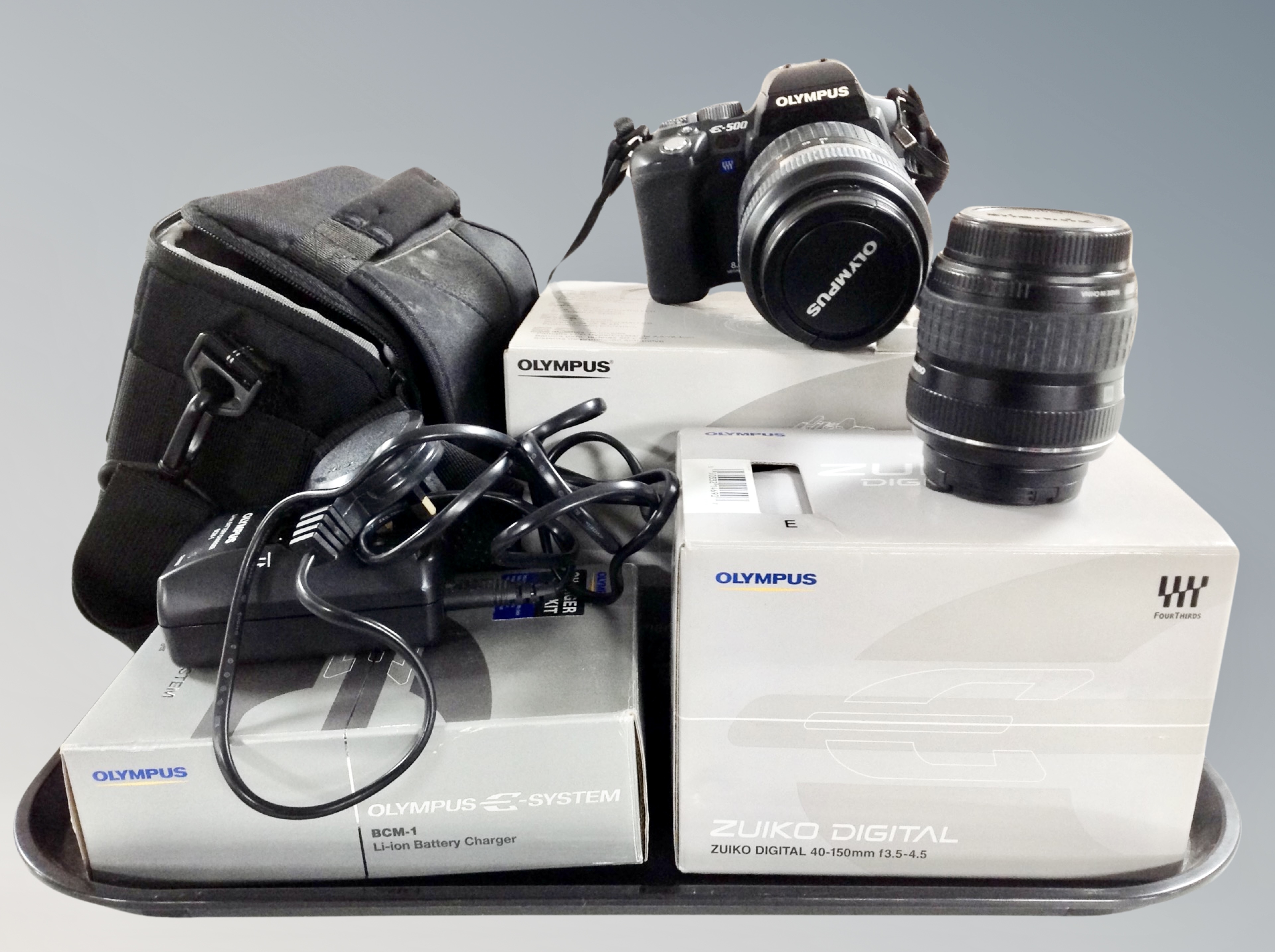 An Olympus E-500 camera with Zuiko digital 40-150 mm lens, further Olympus digital 17.