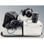 An Olympus E-500 camera with Zuiko digital 40-150 mm lens, further Olympus digital 17.