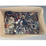 A box of various costume jewellery