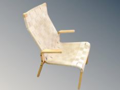 A Scandinavian beech framed armchair with canvas webbed seat