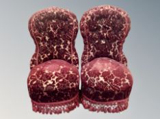 A pair of late 19th century salon chairs in Burgundy tasseled fabric