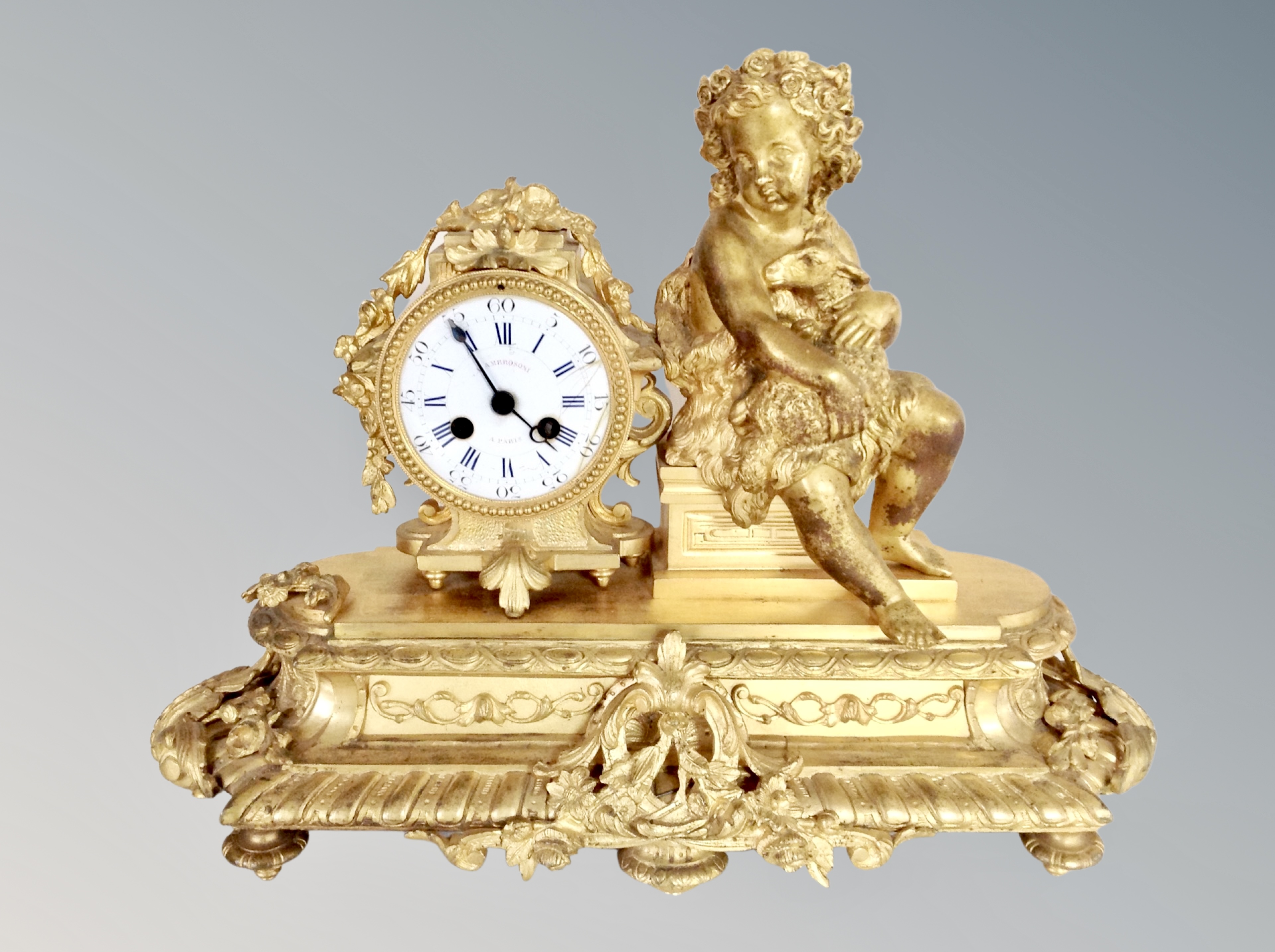 A French gilt bronzed figural eight day mantel clock