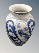 A Chinese style porcelain baluster vase,