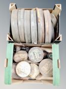 Two boxes of cinema film reels in tins
