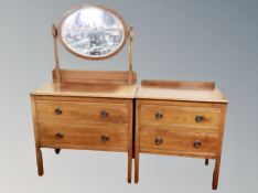 An Edwardian mahogany two drawer dressing chest and matching two drawer chest