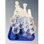 A set of ten frosted glass champagne flutes together with three decanters and five two tone wine