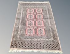 A Lahore Bokhara rug, Pakistan, on peach ground,