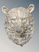 A resin wall plaque in the form of a bear's head,