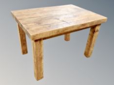 A contemporary pine rectangular dining table,