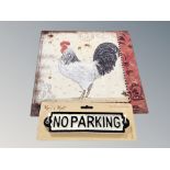A contemporary no parking sign and a tin sign depicting a cockerel