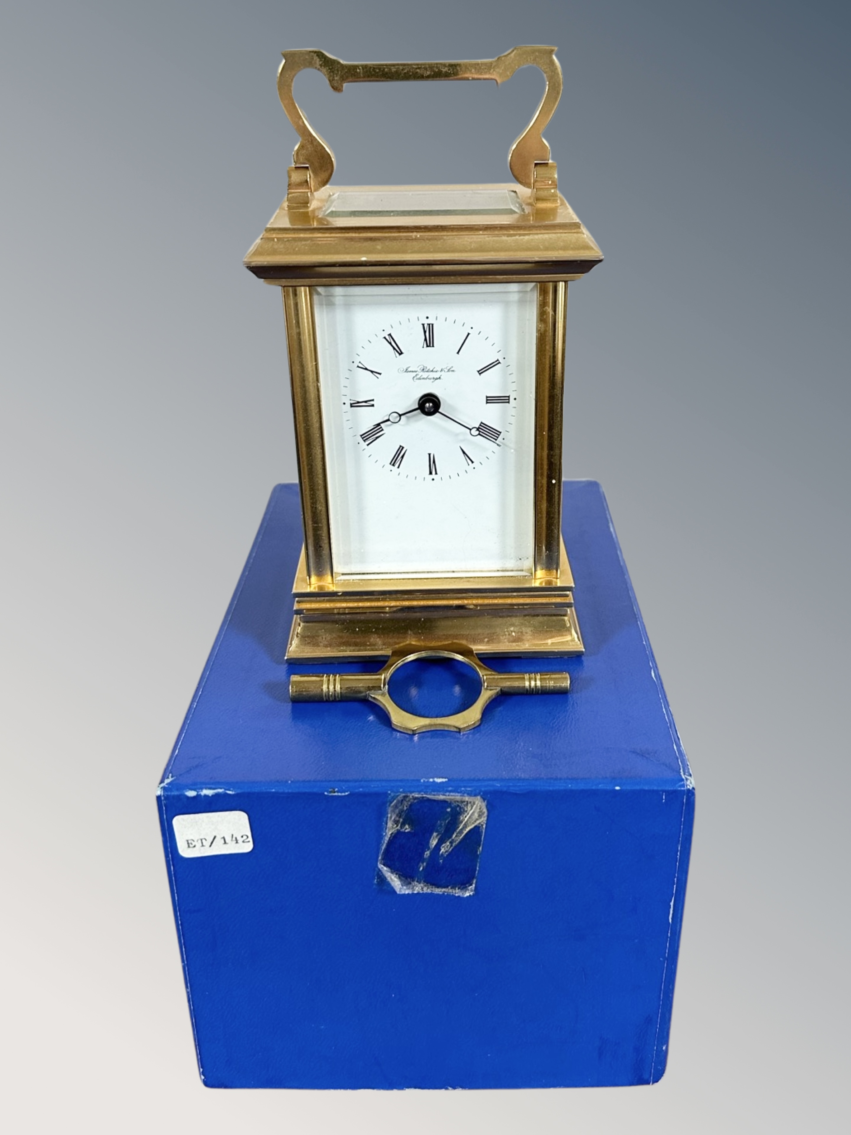 A heavy quality brass carriage clock with key by James Ritchie & Son, boxed.