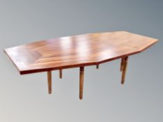 A unique shield shaped hardwood dining table on pine stand, 246 cm x 123.