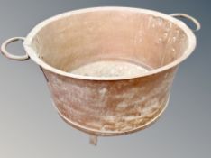 A large 19th century copper twin handled cooking pot,