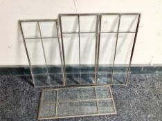 Four metal framed bevelled glass window panes