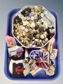 A tin of military buttons,