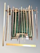 A group of wooden items, wood working brace, banner pole in the form of an axe,