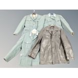 Three Eastern European 1950's military tunics with trousers together with a black leather jacket