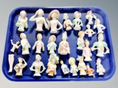 A collection of china half dolls